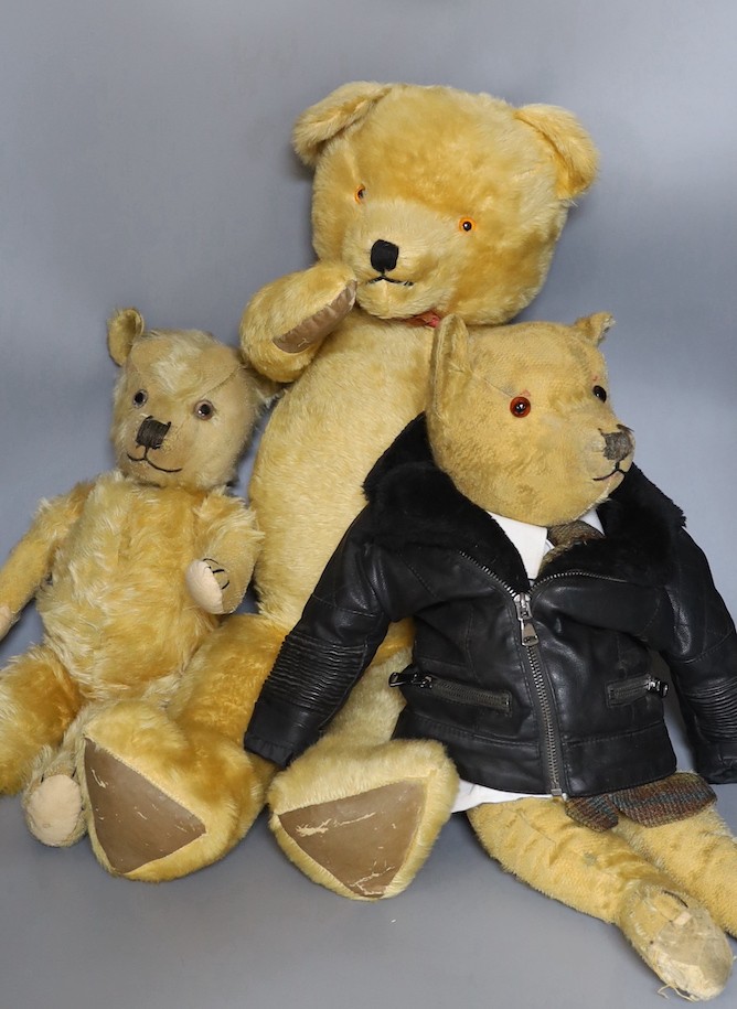 A large 1960's mohair bear, 75cm, a Chiltern 1930's bear, 50cm, and an English bear, dressed in bikers jacket and shirt, 54cm.